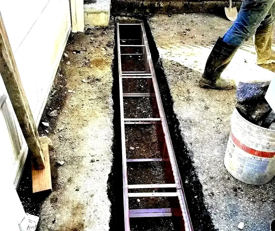 Dug trench French Drain Installation Lexington, KY